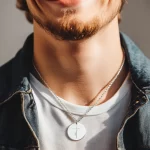 "Sing in the Storm" Pendant with Floral Cross Engraving